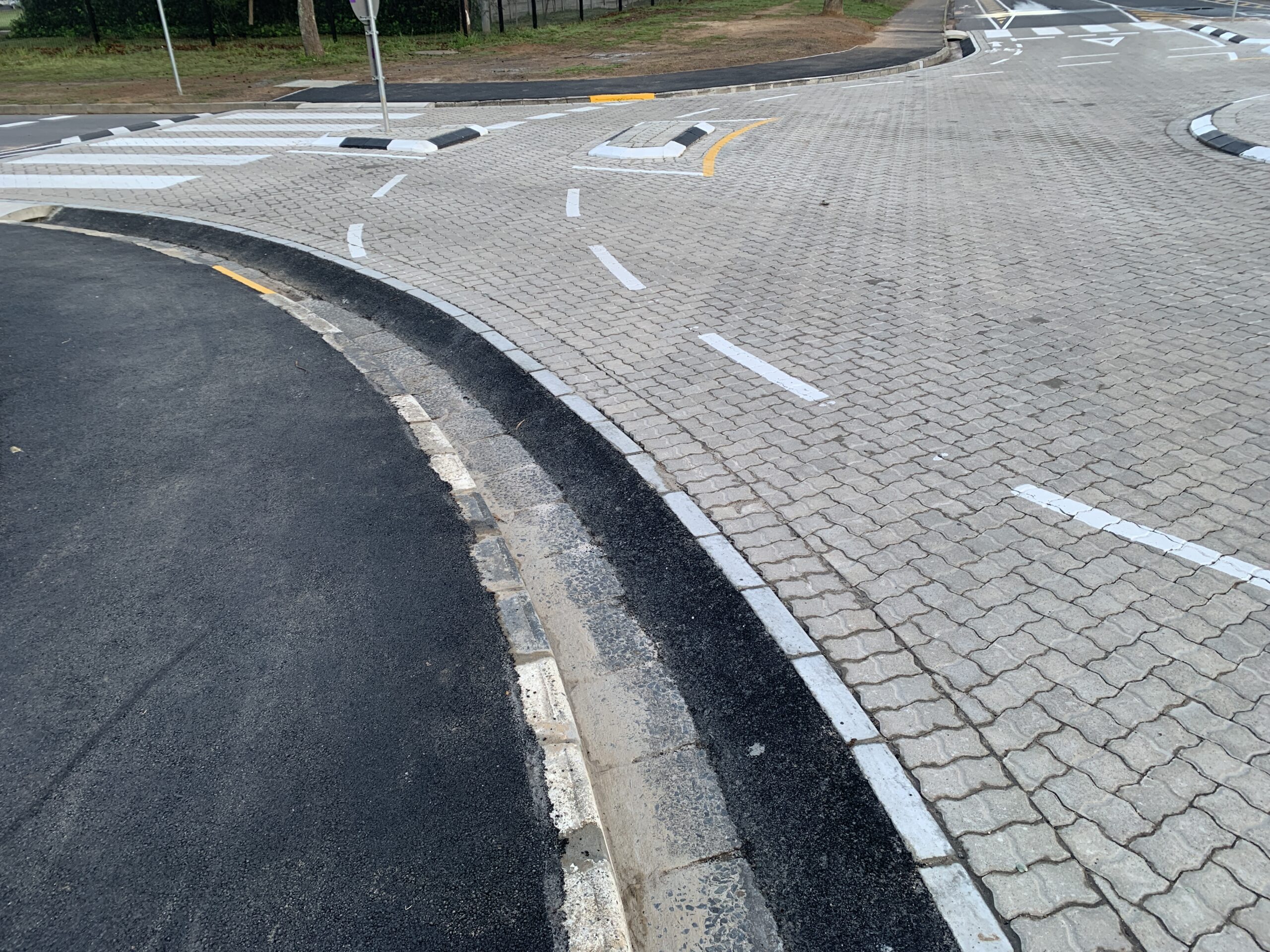 Deep drainage along side very narrow cycle lane.
