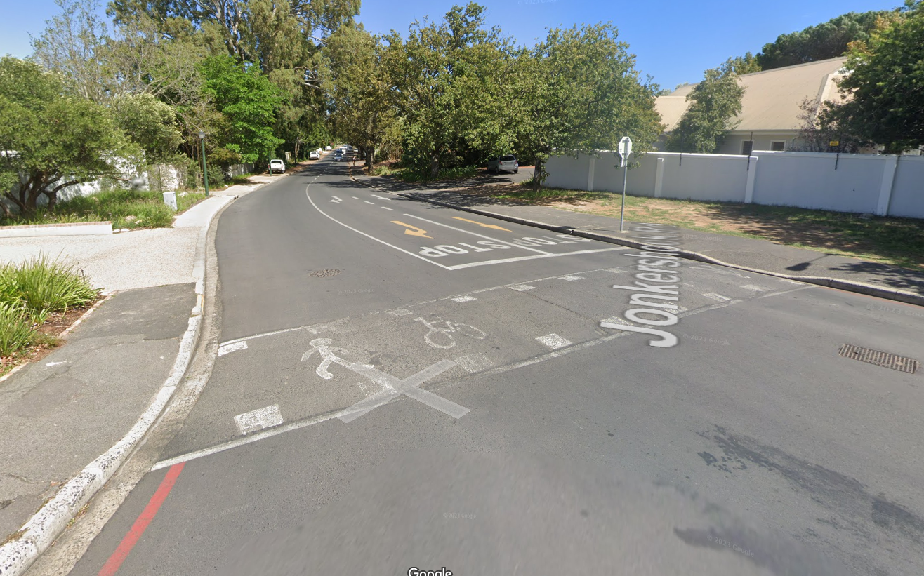 Pedestrian crossing three traffic lanes.
